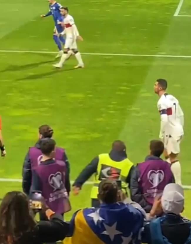 Shocking moment furious Cristiano Ronaldo is hurt by pitch invader trying to take selfie during Portugal clash - Bóng Đá