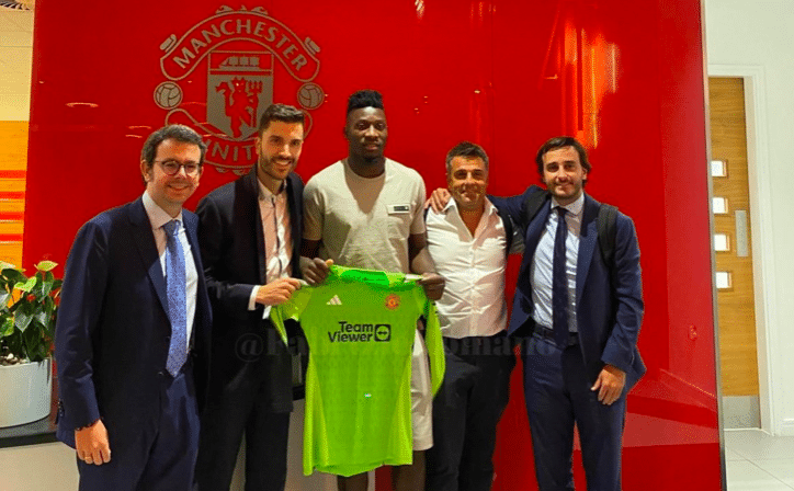 Andre Onana pictured holding a Man Utd shirt at Carrington - Bóng Đá